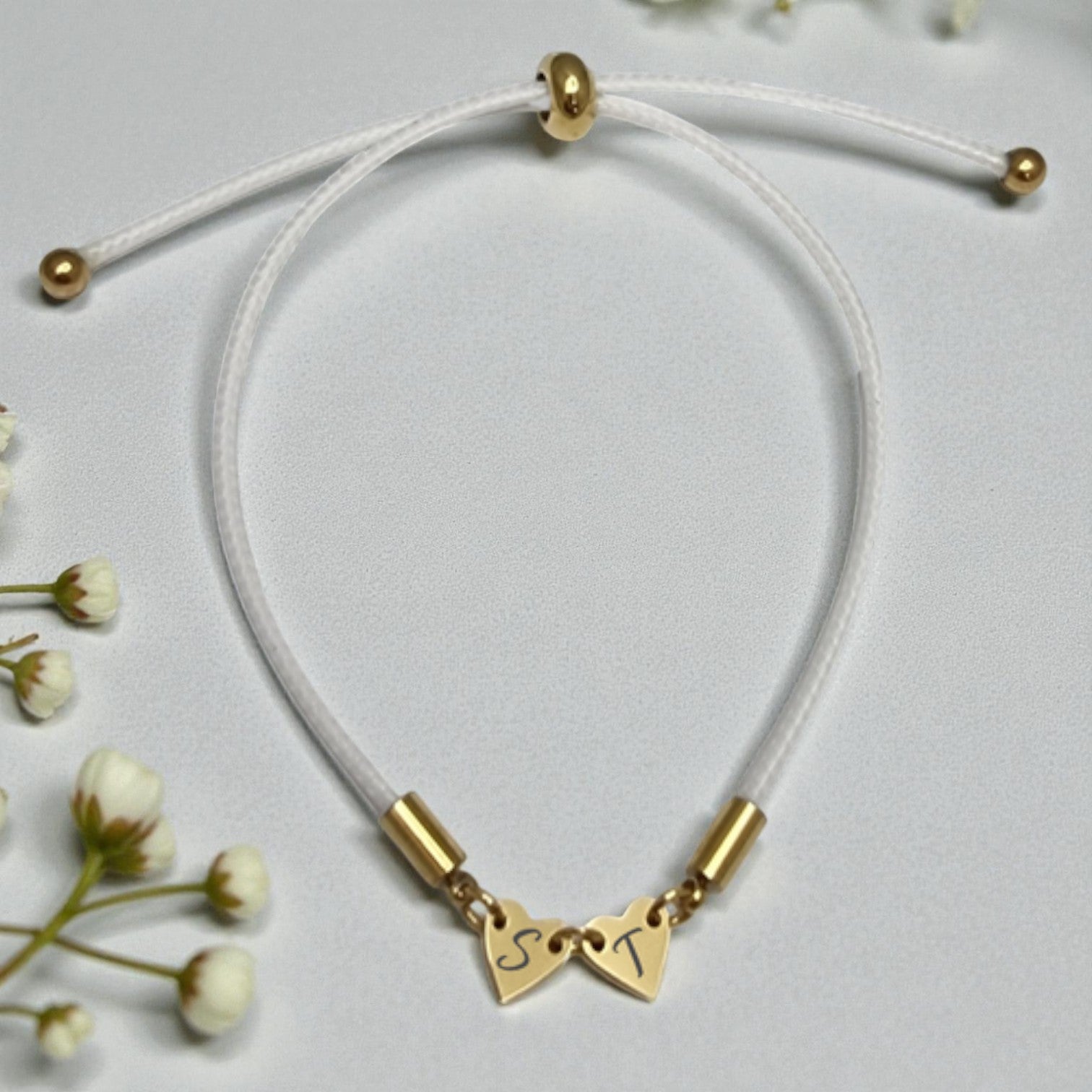 White Cord Bracelet with 2 Heart Engraved Charms